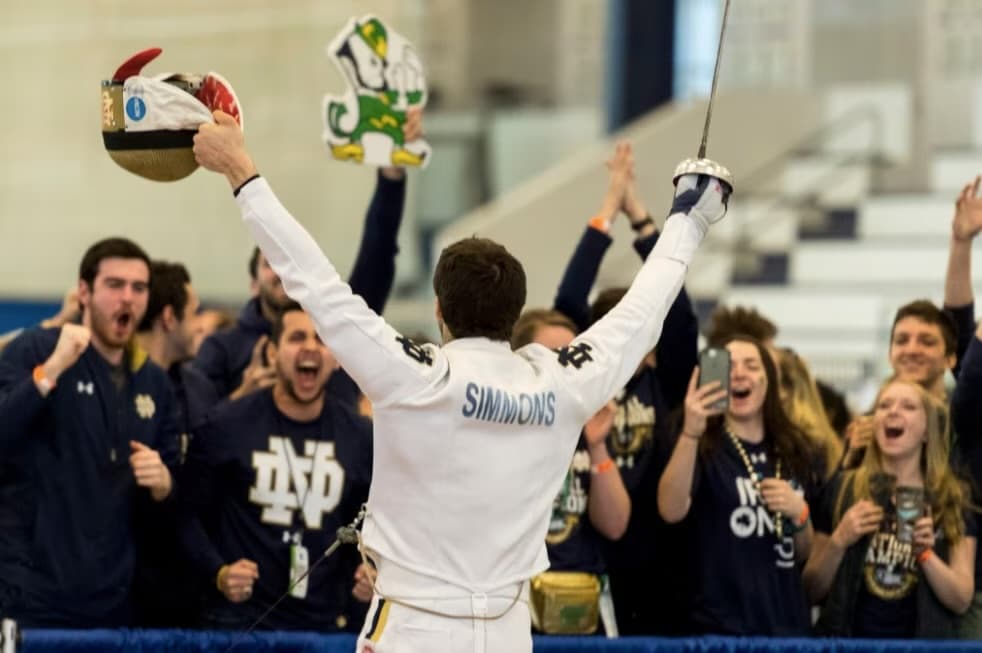 Ari celebrates a Notre Dame NCAA team victory in front of a roaring crowd